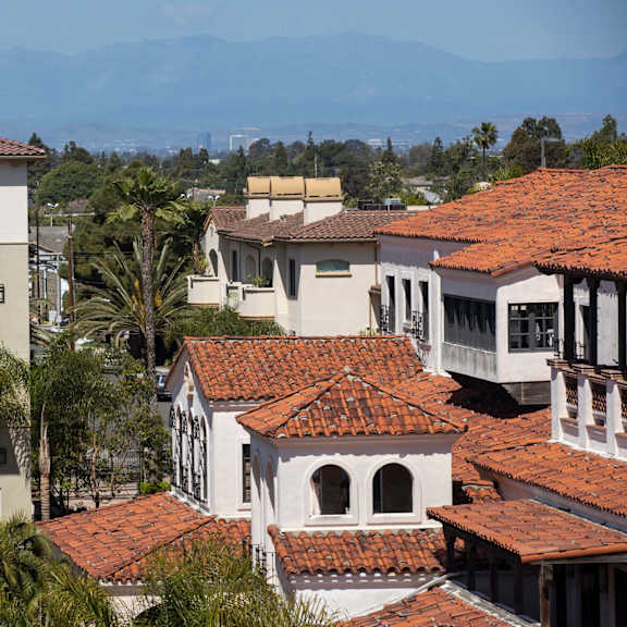 residential buildings with red tile roofs at nineteen90 apartment homes, costa mesa, california