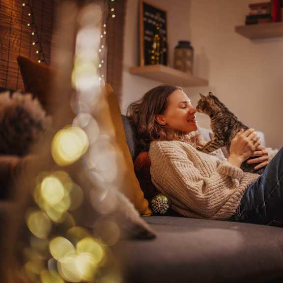 cozy living room with festive lighting at nineteen90 apartment homes, costa mesa, ca