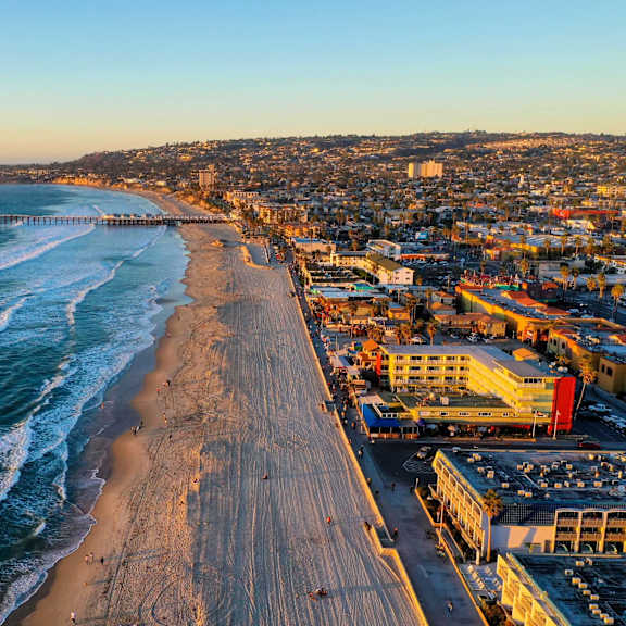coastal beach and pier aerial view at nineteen90 apartment homes, costa mesa, california