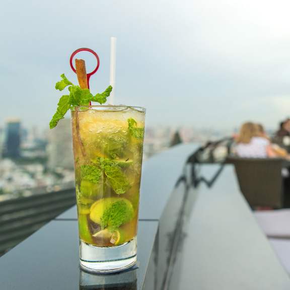 a cocktail on the ledge of a skyscraper