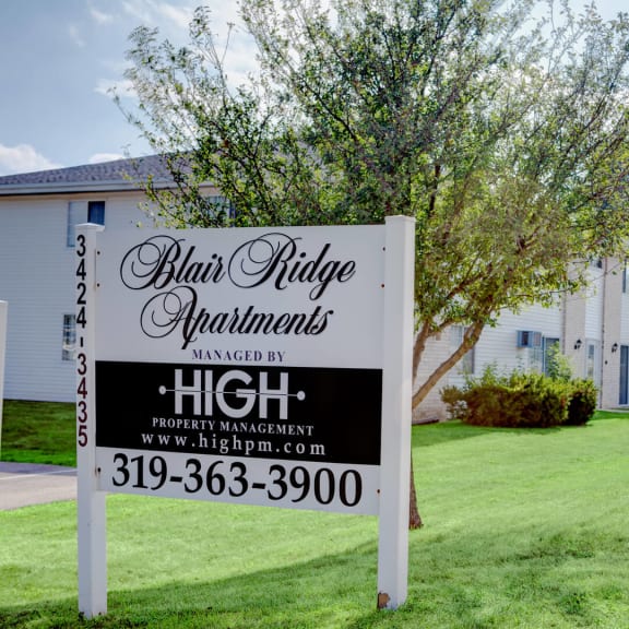 a real estate sign in front of a house