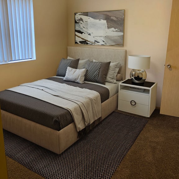 a bedroom with a bed and a nightstand