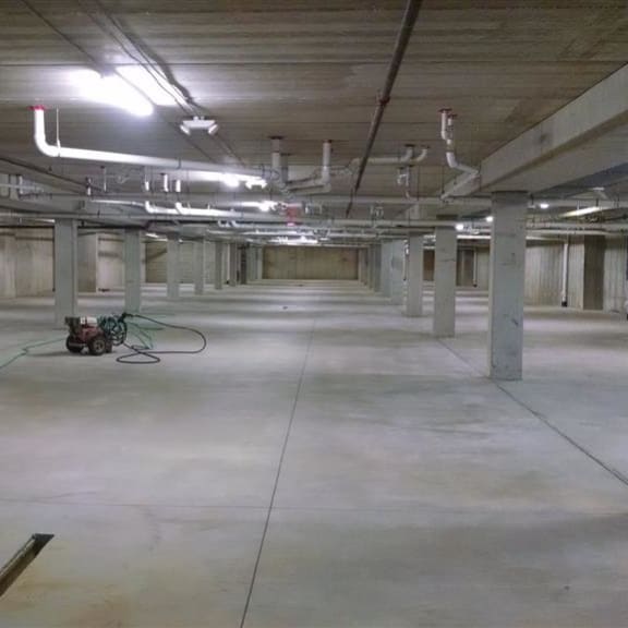 a large empty room with a bunch of wires on the floor