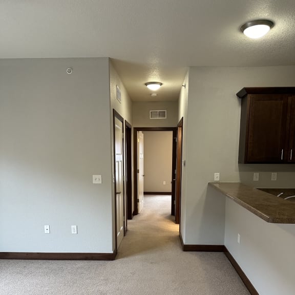 a kitchen with a stove and a microwave in a house
