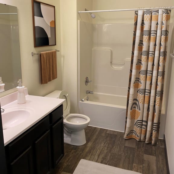 a bathroom with a bathtub toilet and sink