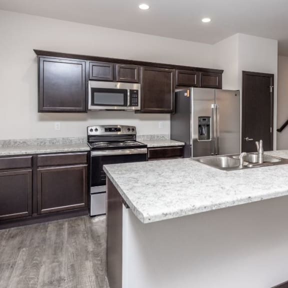 a kitchen with a counter top and a sink