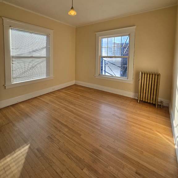 a small attic room with a skylight and a window. at casa del rey apartments, portland, oregon
