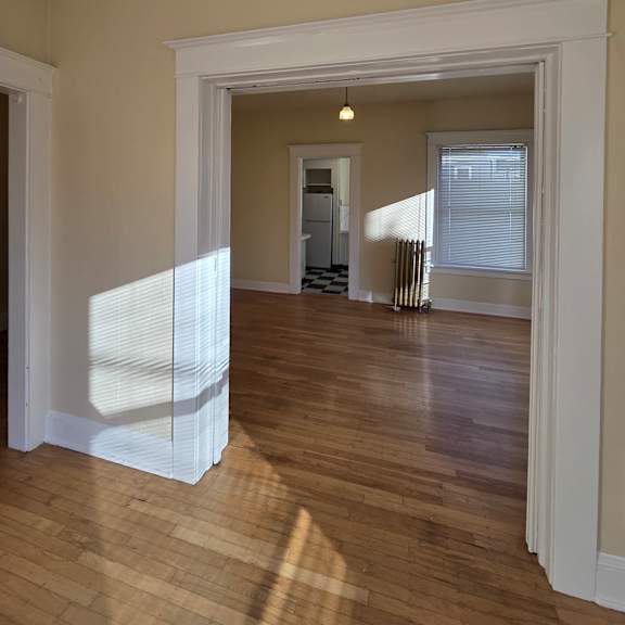 a white window in a room with wooden walls. at casa del rey apartments, oregon, 97209
