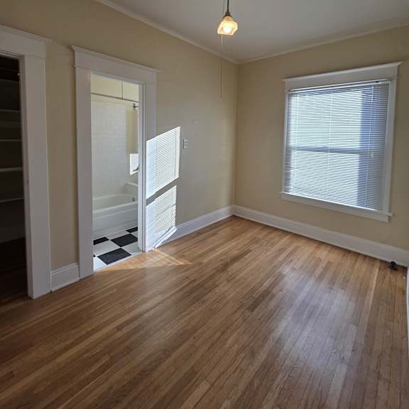 a small attic room with a skylight and a small table. at casa del rey apartments, oregon