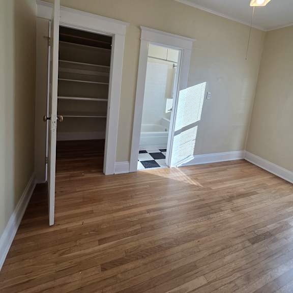 a small attic room with a skylight and a window. at casa del rey apartments, portland, 97209