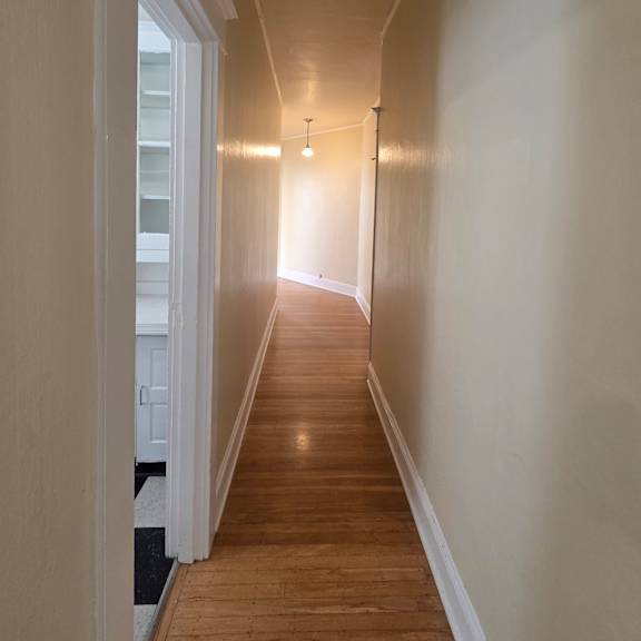a long, narrow room with wooden walls and a skylight in the middle. at casa del rey apartments, portland, or, 97209