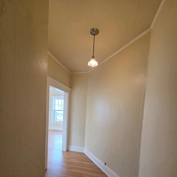 a small attic room with a skylight and a light on. at casa del rey apartments, oregon, 97209