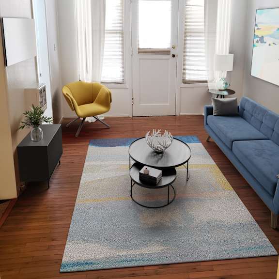 a living room with a blue couch and a yellow chair