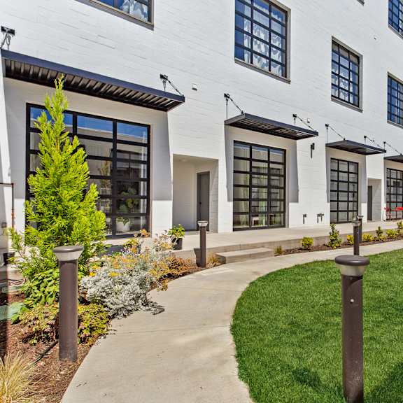 a white building with black trim and windows.