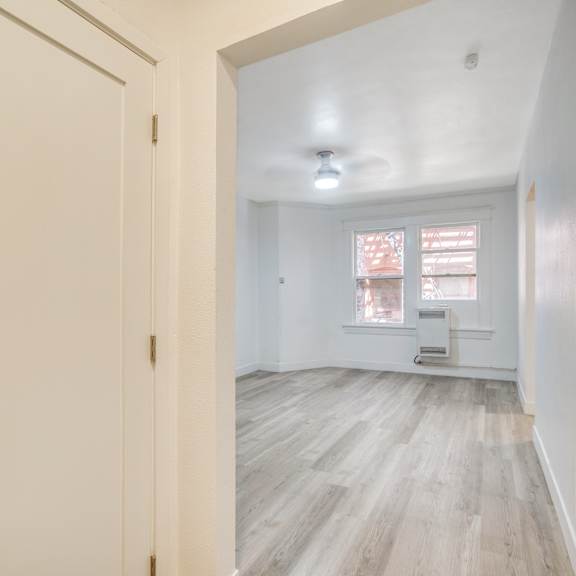 a white door with a black handle is on the left side of the image at clay & tiffany, portland, 97201