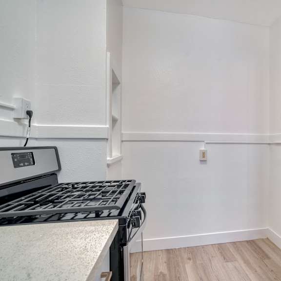 a kitchen with a stove top oven and a counter top at clay & tiffany, portland, 97201