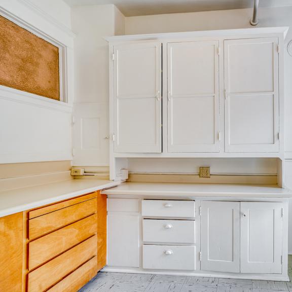 a white kitchen with a stove and oven at clay & tiffany, portland, 97201