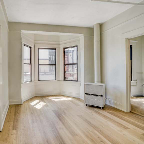 a room with wooden floors and white walls at clay & tiffany, portland, 97201