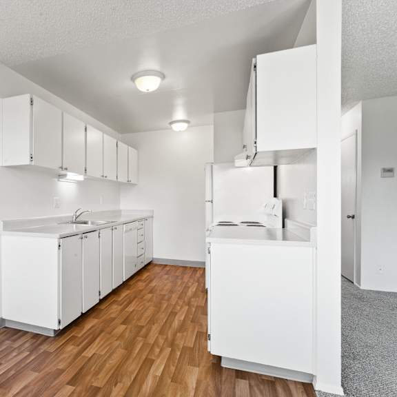 kitchen with white cabinets at garden villa apartments, portland, or