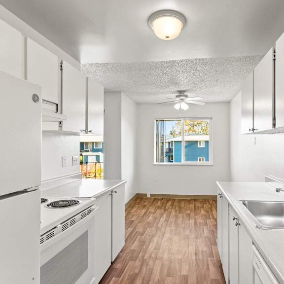 kitchen with white appliances at garden villa apartments, oregon, 97266