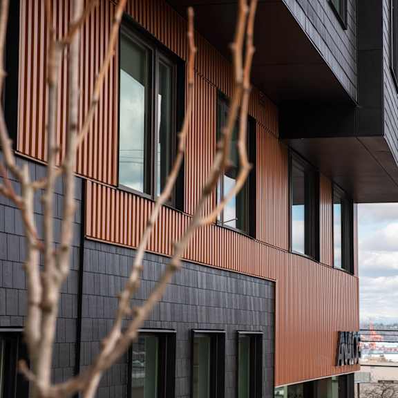 a view of the corner of a building with a city in the background at analog tacoma, tacoma, wa, 98402