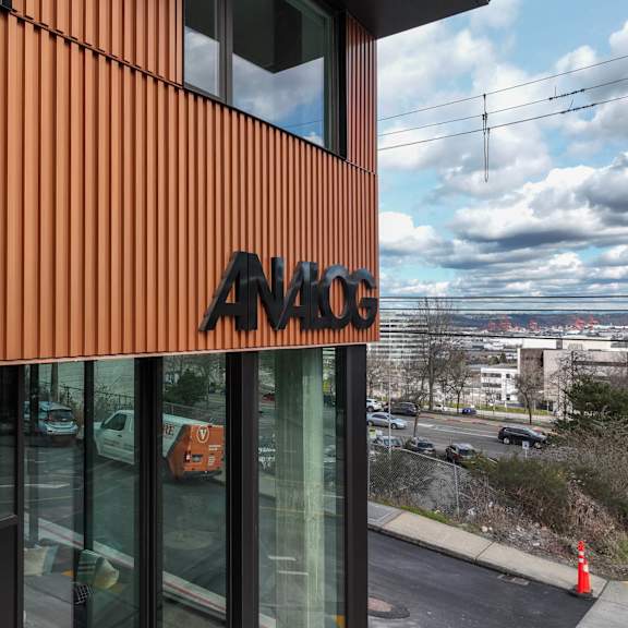 the facade of a building on the side of it at analog tacoma, tacoma