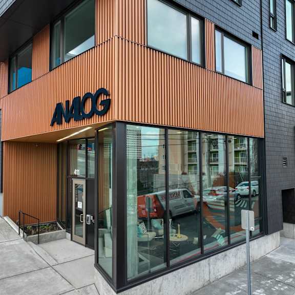 the front of an office building with a glass door at analog tacoma, tacoma, washington
