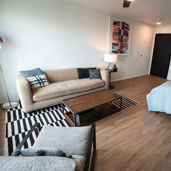 a living room with a couch and a bed at analog tacoma, washington