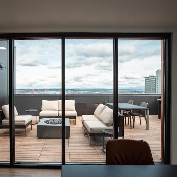 a balcony with a city view and a table and chairs at analog tacoma, tacoma, wa