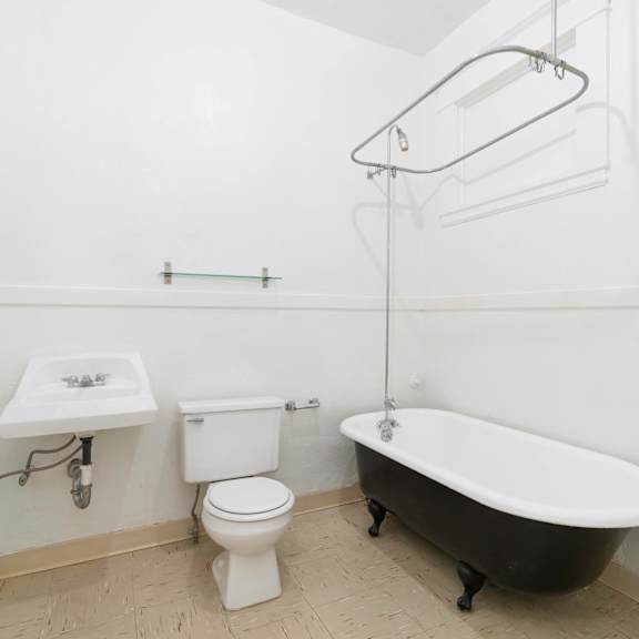 a bathroom with a sink toilet and a bath tub at clay & tiffany, portland, or, 97201