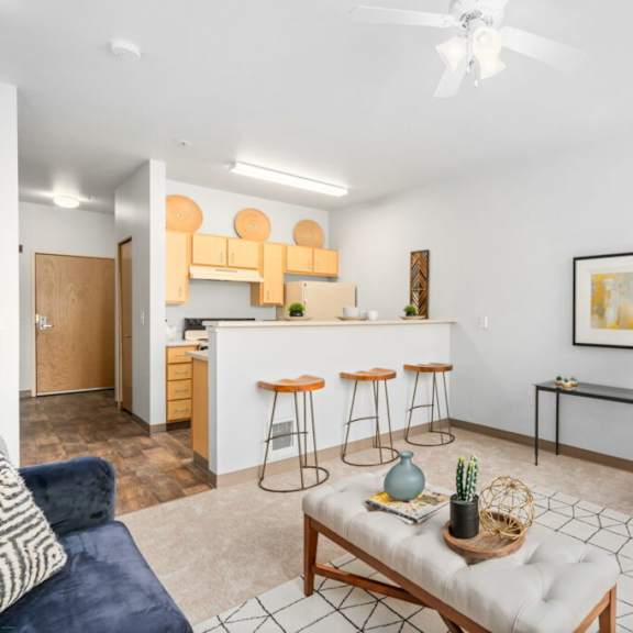 living room with kitchen view at fifth avenue place apartments, portland, 97209