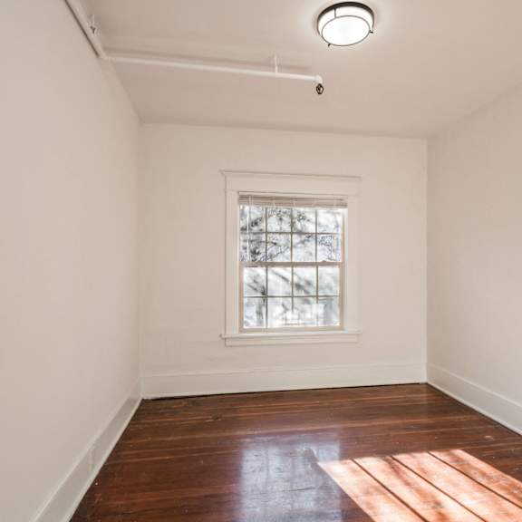 a room with a window and a door at midtown apartments, portland, or, 97209
