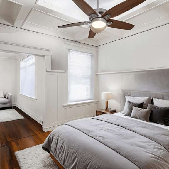 a bedroom with a large bed and a ceiling fan at midtown apartments, portland, 97209