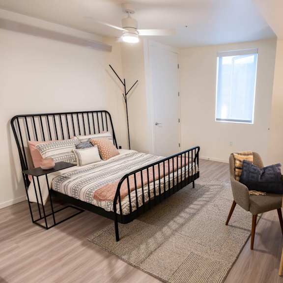 a bedroom with a bed and a desk and a window at moraine, tacoma, wa 98402