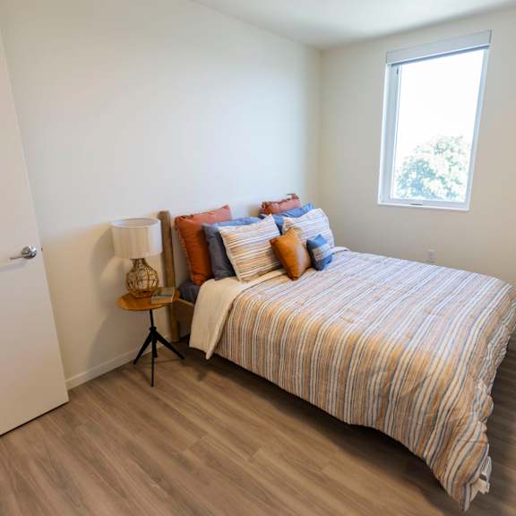 a bedroom with a bed and a window at moraine, tacoma