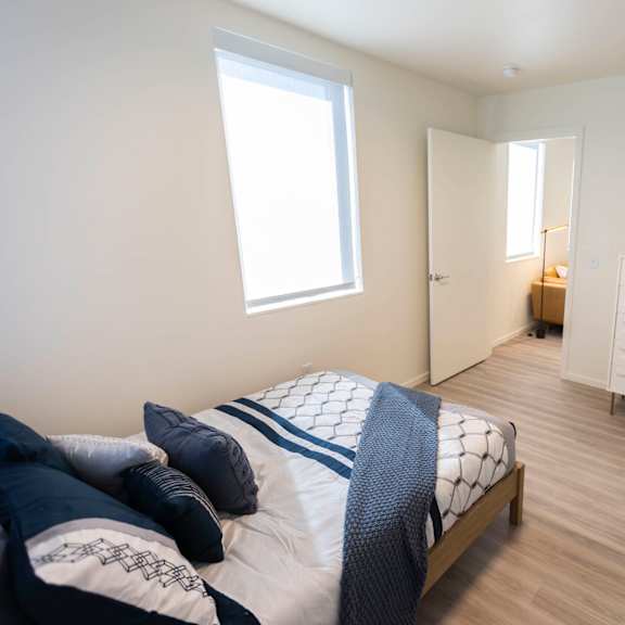 a bedroom with a bed and a dresser in a room at moraine, washington 98402