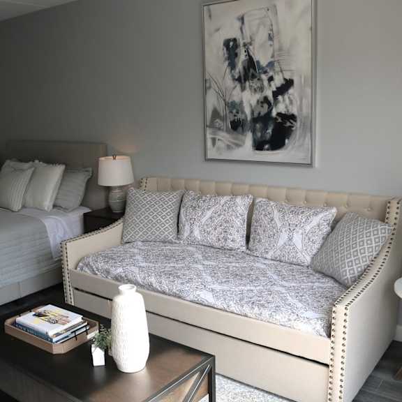 a living room with a couch and a bed at schaefer ridge apartments, branson ,missouri, 65616q