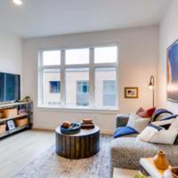 a living room filled with furniture and a flat screen tv at holm at sellwood, oregon, 97202