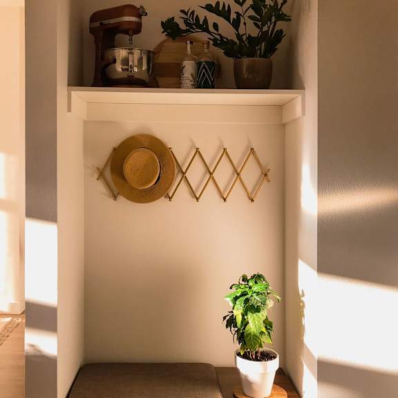 a small nook with a plant and a stool at holm at sellwood, portland