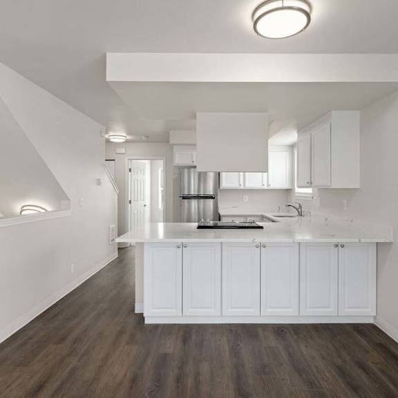 a kitchen with a counter top and a sink