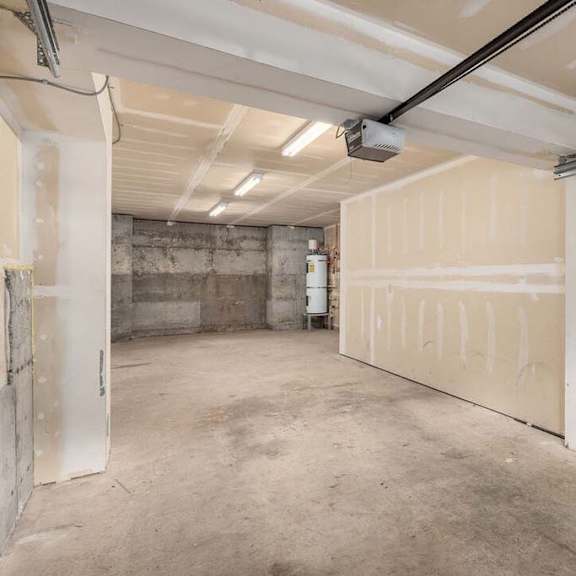 a garage with a white door and white walls