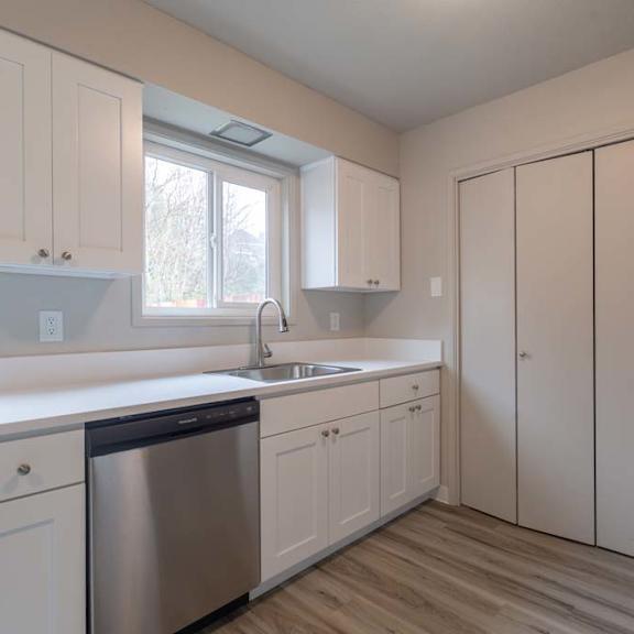 a kitchen with a sink and a window