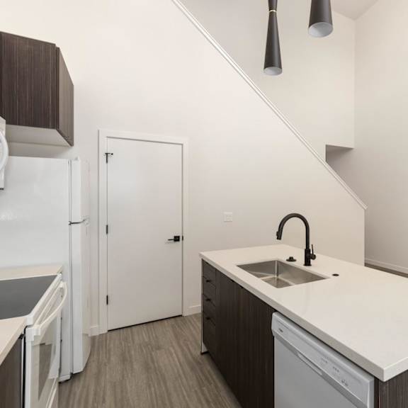 a kitchen with a sink and a dishwasher