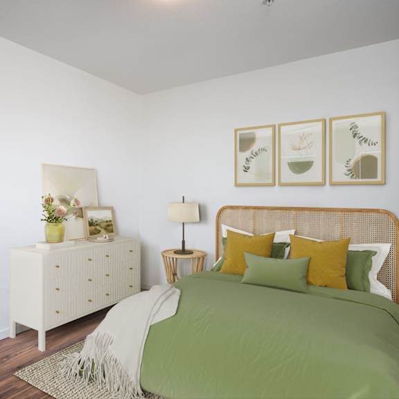 a bedroom with a bed, nightstand, and a plant on the nightstand.
