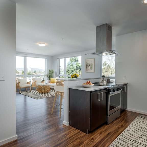 a kitchen with a black stove top oven and a black refrigerator.
