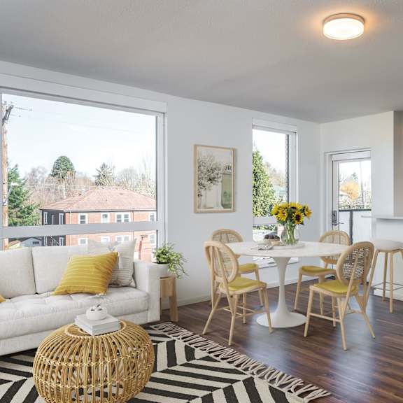 a modern kitchen with a dining table and chairs.