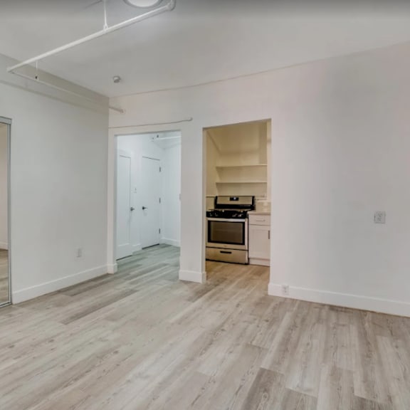 a room with a wooden floor and a kitchenette in the corner at clay & tiffany, portland, 97201