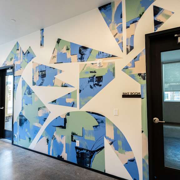 a wall with a geometric design in front of a door at shift, portland, 97217