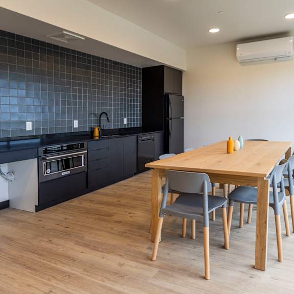 a kitchen and dining room with a wooden table and chairs at shift, oregon, 97217