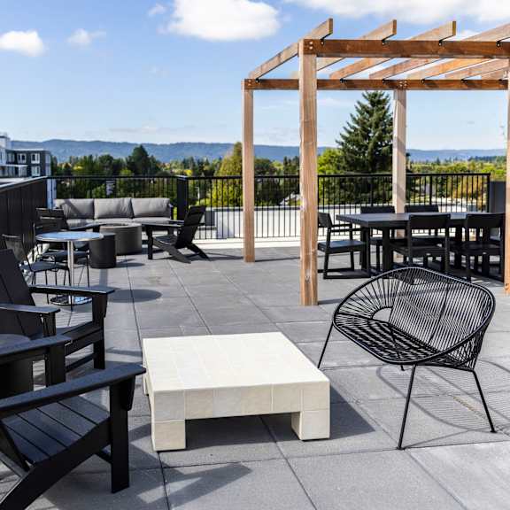 the deck on the top of a building with chairs and tables at shift, portland, 97217